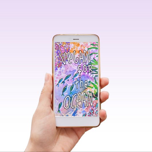 Hand holding a phone with 'Vegan for the Ocean' screen on a light purple background