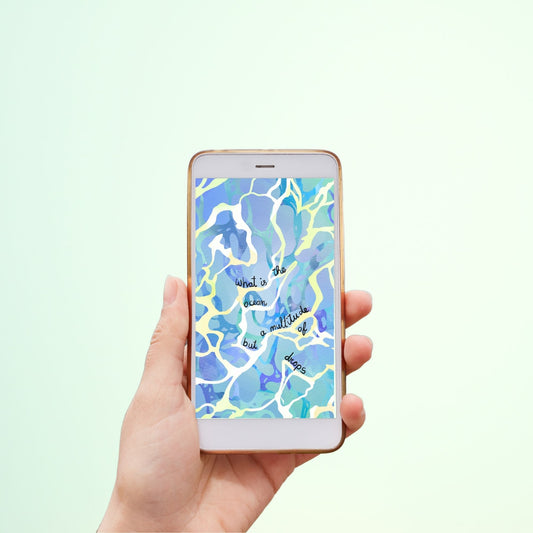 Hand holding a smartphone with an abstract ocean background. 